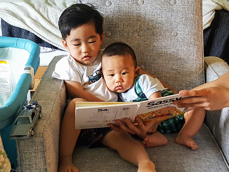 Ray and Hal Reading on Sofa