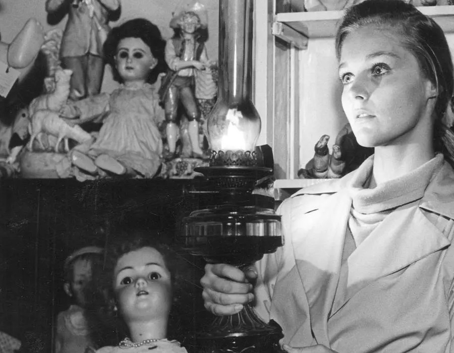 Ann looking at dolls