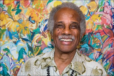 Headshot of Ashley Bryan. He is an older African American man with white hair and a mustache, 