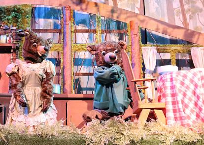 marionette bears on a goldilocks stage set
