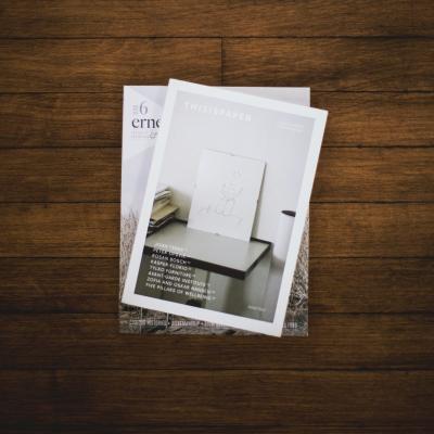 single magazine on a brown wooden table